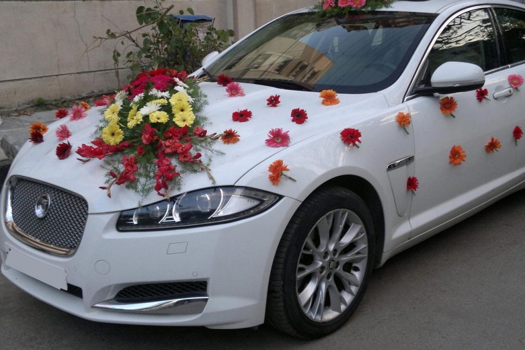 wedding car with flower & sash
